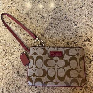 New without tags Coach wristlet brown and dark magenta